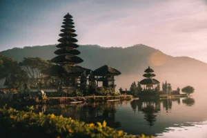 Pura Ulun Danu Bratan temple in Bali on a misty morning, representing the serene atmosphere of dry season.